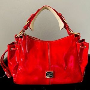 Dooney & Bourke red patent leather handbag.  8”x14” in perfect condition.